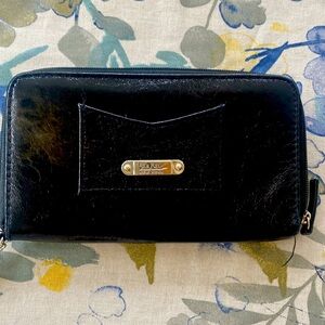 Nicole Miller black purse, 8 x 4 new tags all zip is work preowned